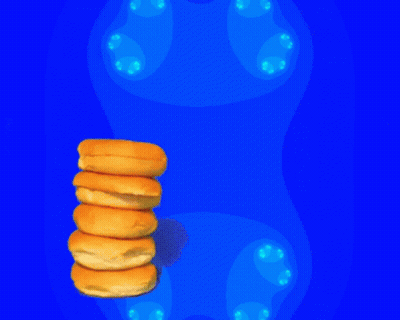 Stack Of Doughnuts On Blue Background GIF