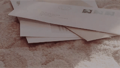 Stack Of Envelopes With USPS Stamp GIF