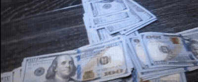 Stack Of Hundred Dollar Bills On Wooden Table GIF