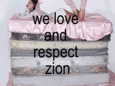 Stack Of Mattresses With We Love Zion GIF