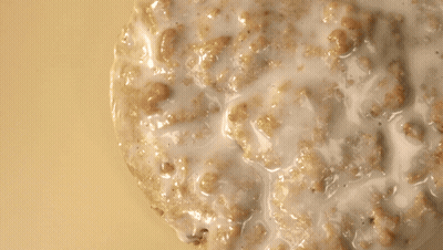 Stack Of Pancakes Being Poured With Milk GIF