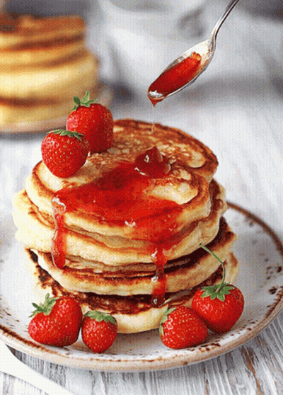 Stack Of Pancakes With Strawberries And Syrup GIF