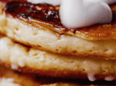 Stack Of Pancakes With Syrup And Whipped Cream GIF