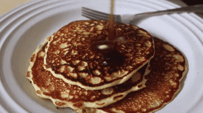 Stack Of Pancakes With Syrup Being Poured GIF