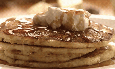 Stack Of Pancakes With Whipped Cream And Syrup GIF