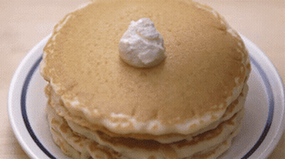 Stack Of Pancakes With Whipped Cream GIF