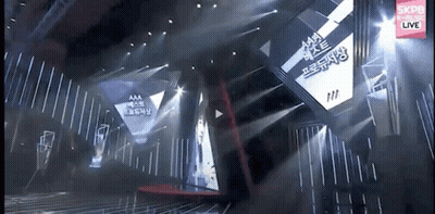 Stage With Large Screen Saying Aaa GIF