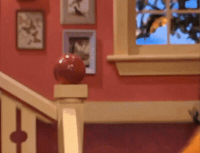Staircase With Red Ball On Railing And Window GIF