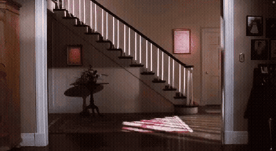 Staircase With Table And Wall Pictures GIF