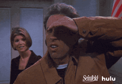 Stalking Jerry Seinfeld Shielding Eyes GIF