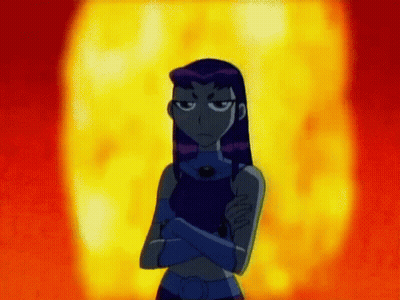 Starfire From The Teen Titans Go Is Standing In Front Of A Fireball With Her Arms Crossed . GIF