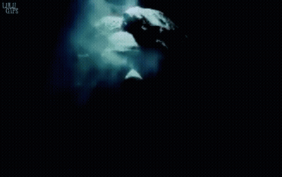 Statue Of A Man Surrounded By Smoke Saying Lulu Girls GIF