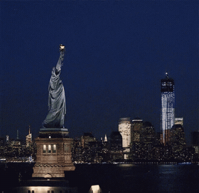 Statue Of Liberty Foreground Twin Towers Background GIF