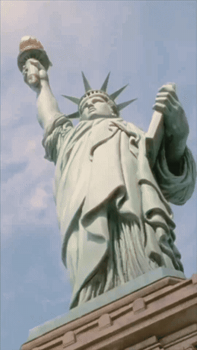 Statue Of Liberty Holding Torch And Book GIF