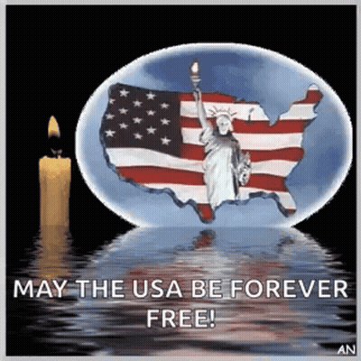 Statue Of Liberty In Snow Globe With American Flag And Candle GIF