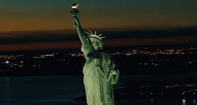 Statue Of Liberty Lit Up At Night GIF