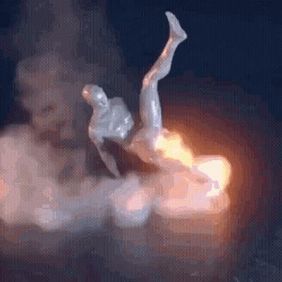 Statue Of Man Falling Into Fire GIF