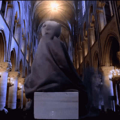 Statue Of Man Sitting On Box In Building GIF