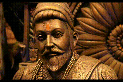 Statue Of Man With Beard And Necklace GIF