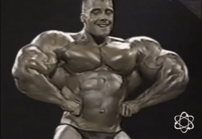 Statue Of Man With Huge Muscles And Small Atom GIF