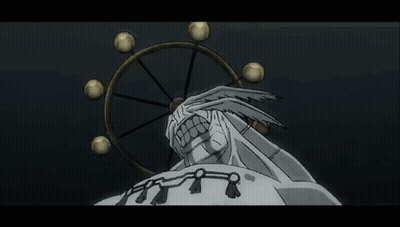 Statue Of Man With Large Mouth In Front Of Spinning Wheel GIF