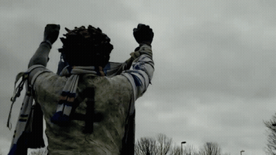 Statue Of Man With Scarf And Number 4 On Back GIF