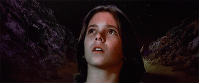 Statue Of Naked Woman With Necklace In Dark Room GIF