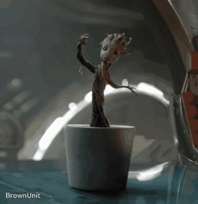 Statue Of Tree In Pot Saying Brown Unit GIF