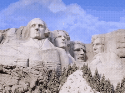 Statue Of US Presidents On Mountain GIF