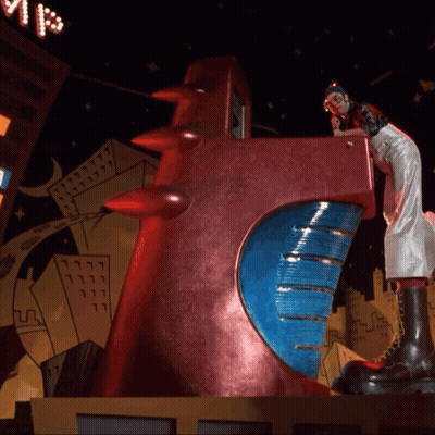 Statue Of Woman On Red Object With Blue Circle GIF