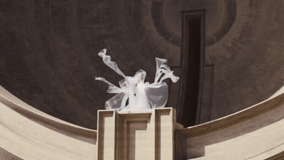 Statue With Smoke Coming Out On Pedestal GIF