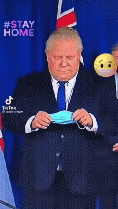 Stay Home Smiley Behind Masked Man In Suit GIF