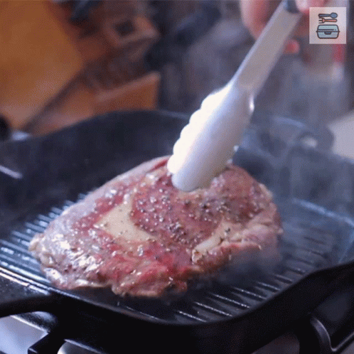 Steak Cooking On Grill With Tongs GIF