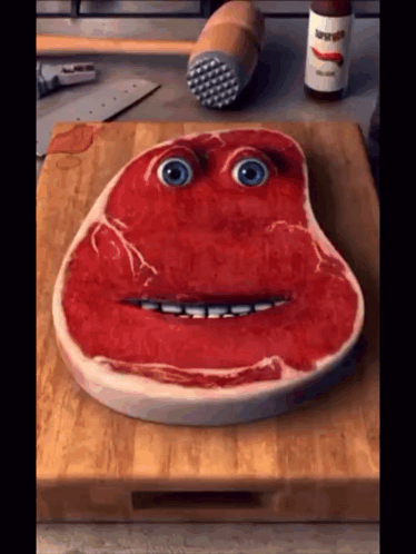 Steak With Face On Cutting Board GIF
