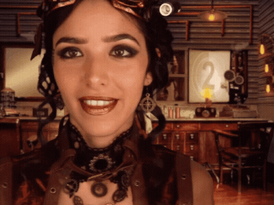 Steampunk Woman Smiling In Front Of Clock GIF