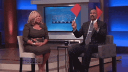 Steve Harvey Waves Two Red Flag GIF
