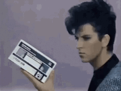 Steve Strange Holding A Vhs Tape Loop GIF