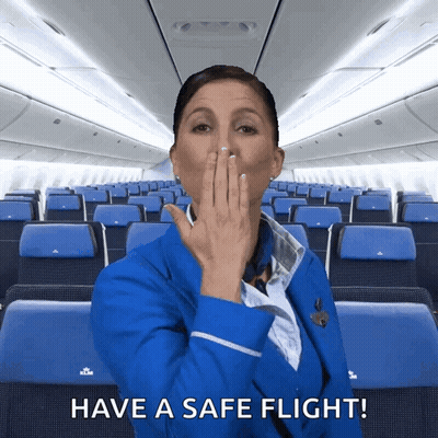 Stewardess Covering Mouth With Safe Flight GIF