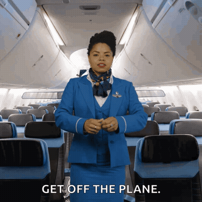 Stewardess In Blue Suit Telling Passengers To Get Off GIF