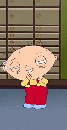 Stewie From Family Guy Is Standing In Front Of A Row Of Drawers . GIF