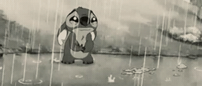 Stitch From Disney 'S Lilo And Stitch Is Crying In The Rain In A Black And White Photo . GIF