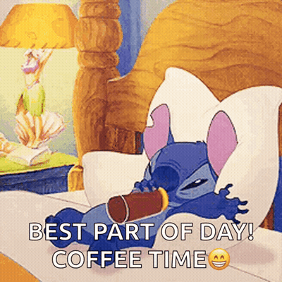 Stitch Is Laying In Bed With A Cup Of Coffee GIF
