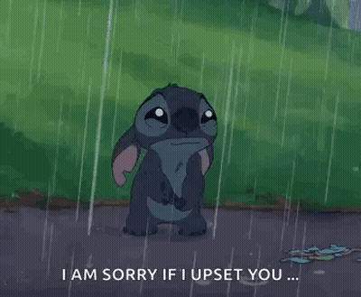 Stitch Is Standing In The Rain With A Sad Look On His Face . GIF