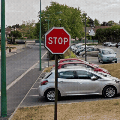 Stop Sign In Parking Lot With Cars GIF