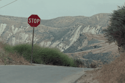 Stop Sign On Side Of Road GIF