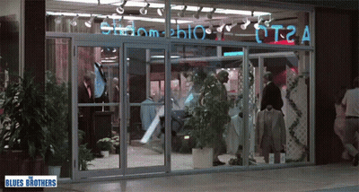 Store Front With Blues Brothers Sign GIF