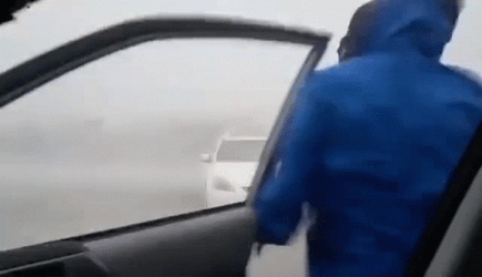 Storm Chaser Being Blown By Strong Wind GIF