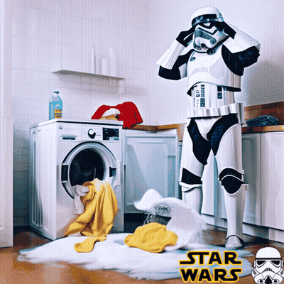 Storm Trooper Standing In Front Of A Washing Machine With Star Wars Written On The Bottom Right GIF
