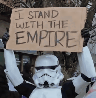 Stormtrooper Holding Sign I Stand With The Empire GIF