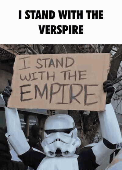 Stormtrooper Holding Sign Saying I Stand With The Empire GIF